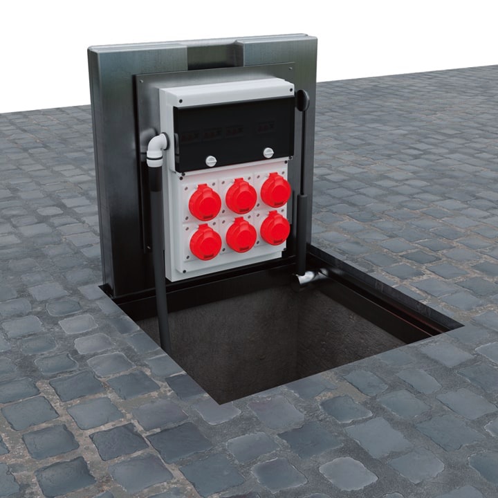 Pop Up Power SuppImage of an in-ground unt with the hinged lid closed